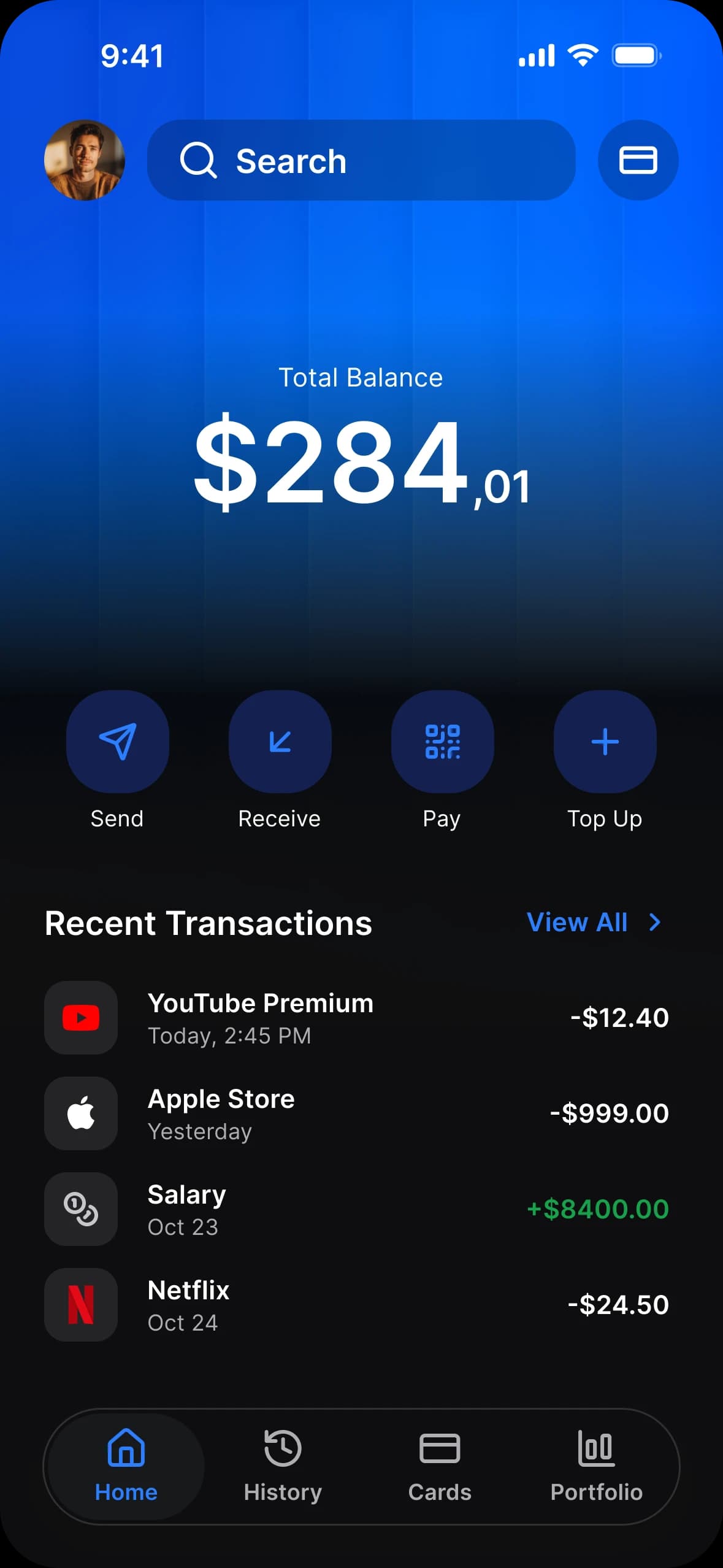 Finance app home in dark mode: a total balance card, Send, Receive, Pay and Top Up, and recent transactions