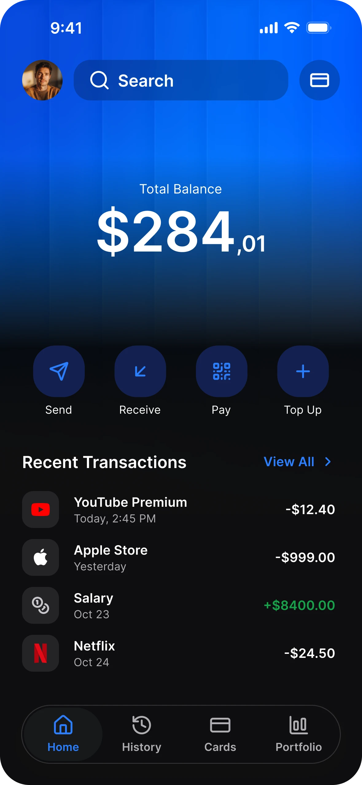 Finance app home in dark mode: a total balance card, Send, Receive, Pay and Top Up, and recent transactions